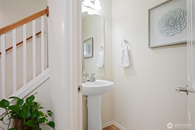 bathroom with baseboards and a sink