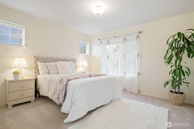 bedroom featuring baseboards, carpet, and visible vents