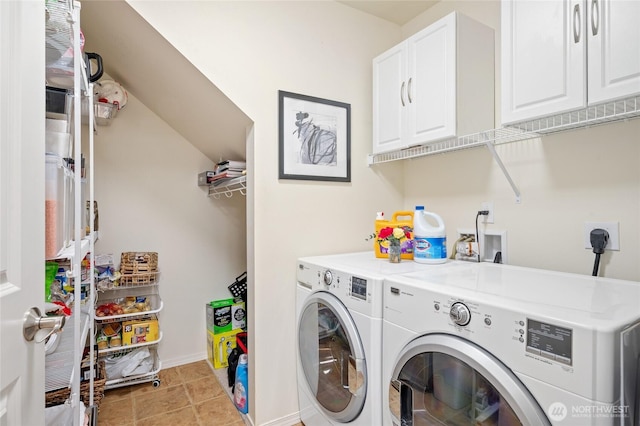 laundry area featuring cabinet space, separate washer and dryer, and baseboards
