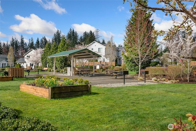 view of home's community featuring a residential view, a gazebo, and a yard