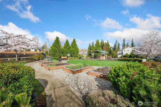 surrounding community featuring a yard, a gazebo, and a garden