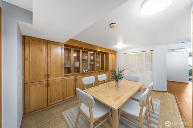 dining area with light wood finished floors