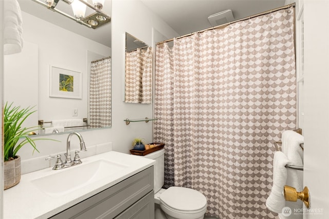 1156 Alki Ave SW Unit 401, Seattle, WA 98116 - bathroom featuring toilet, vanity, and curtained shower