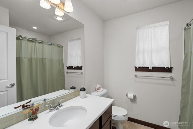 bathroom with a shower with curtain, tile patterned floors, vanity, and toilet