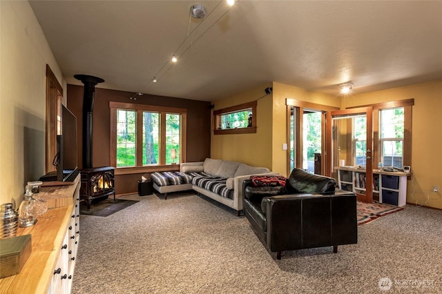 166 White Point Rd, Friday Harbor, WA 98250 - living room featuring a wood stove, carpet flooring, and french doors