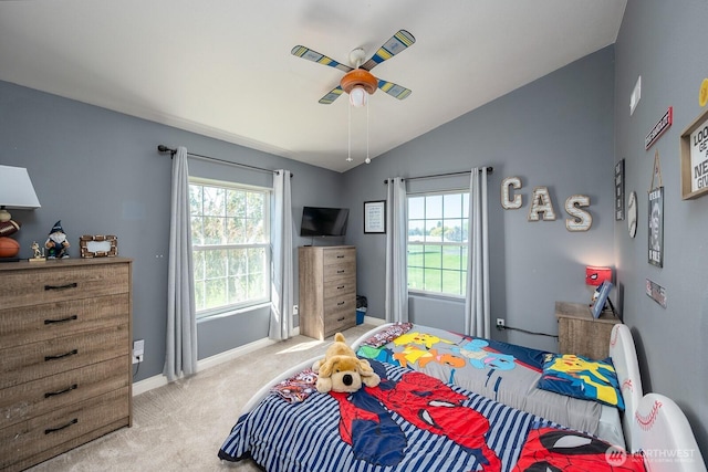 carpeted bedroom featuring baseboards, a ceiling fan, lofted ceiling, and multiple windows