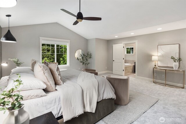 bedroom with carpet floors, recessed lighting, multiple windows, and ensuite bath