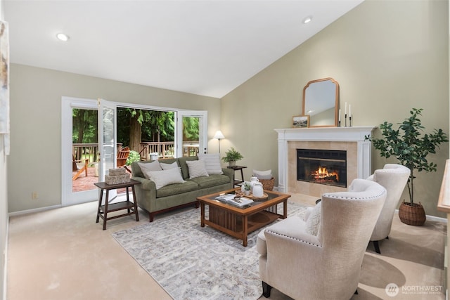 living area featuring recessed lighting, carpet, lofted ceiling, and a fireplace