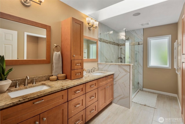 full bath featuring a sink, a marble finish shower, double vanity, and visible vents