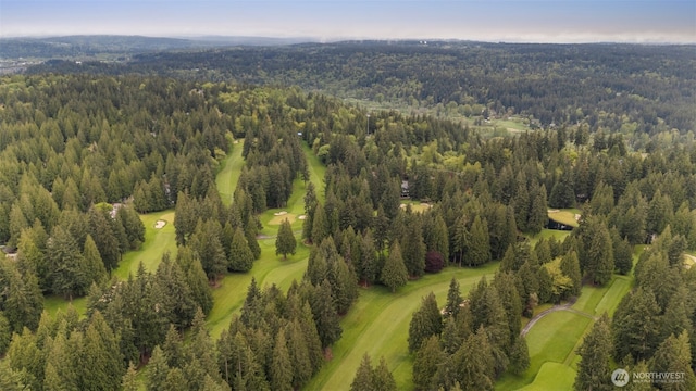 aerial view featuring a view of trees and golf course view