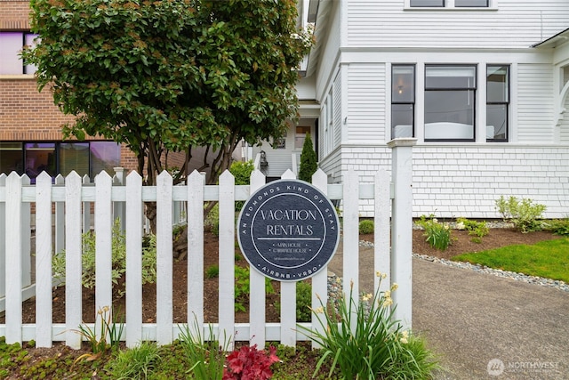 community sign with fence