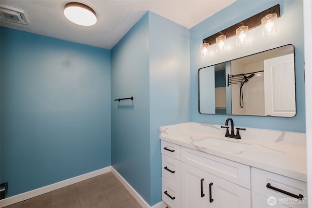 full bath featuring visible vents, walk in shower, baseboards, vanity, and tile patterned floors