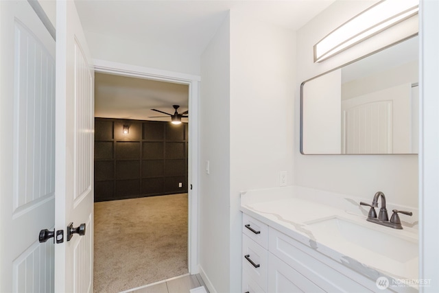 bathroom featuring a ceiling fan and vanity
