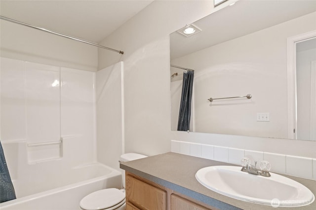 full bathroom with vanity, backsplash, toilet, and shower / tub combination