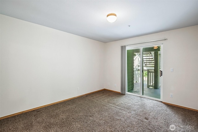 carpeted spare room with baseboards
