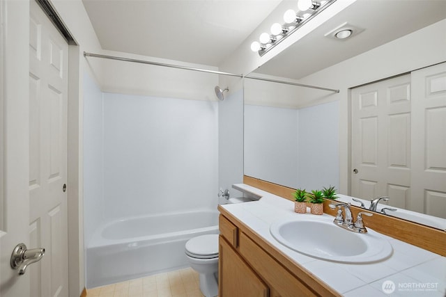 full bathroom featuring vanity,  shower combination, and toilet