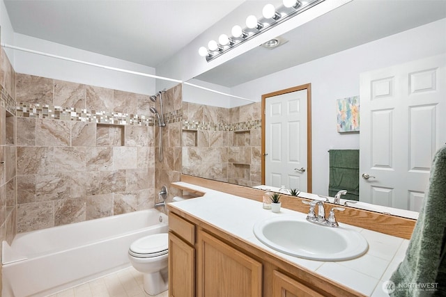 full bathroom featuring washtub / shower combination, vanity, and toilet