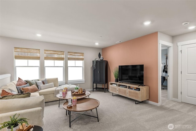 living room with recessed lighting, baseboards, visible vents, and light carpet