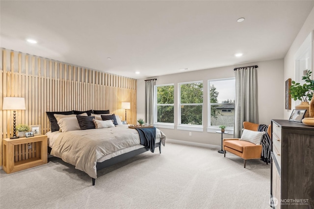 bedroom with baseboards, light carpet, and recessed lighting