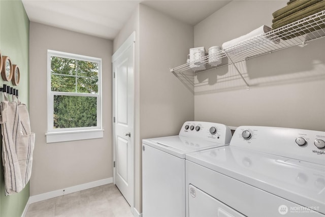 laundry area with washer and dryer, laundry area, and baseboards