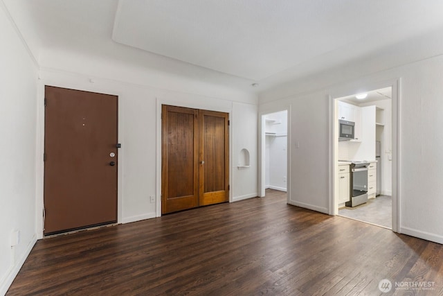 5234 University Way NE, Seattle, WA 98105 - unfurnished bedroom featuring baseboards, wood finished floors, and ensuite bath