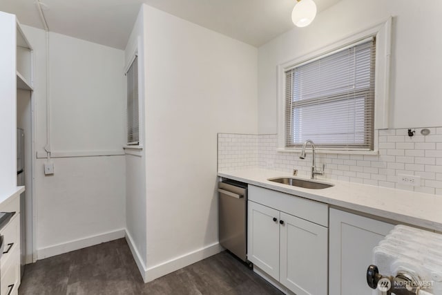 5234 University Way NE, Seattle, WA 98105 - kitchen featuring a sink, dishwasher, dark wood finished floors, baseboards, and decorative backsplash