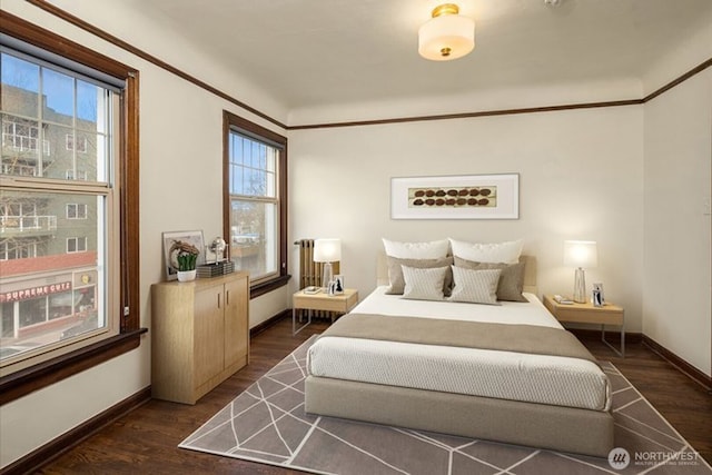 5234 University Way NE, Seattle, WA 98105 - bedroom with baseboards, dark wood finished floors, and multiple windows