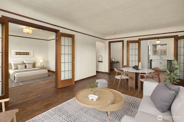 5234 University Way NE, Seattle, WA 98105 - living area with baseboards, french doors, and wood finished floors