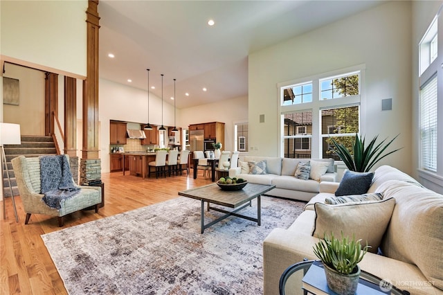 6722 Azalea Way SE, Snoqualmie, WA 98065 - living room with a towering ceiling, light wood-type flooring, recessed lighting, and stairway