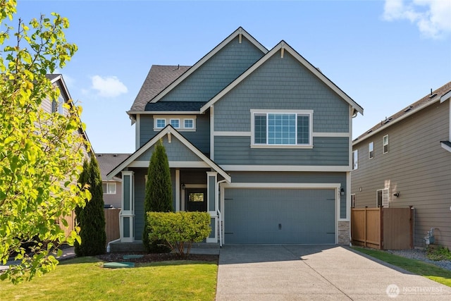 9957 Justman St SE, Yelm, WA 98597 - craftsman inspired home with an attached garage, a front lawn, fence, and concrete driveway