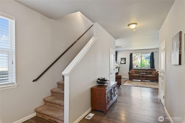 9957 Justman St SE, Yelm, WA 98597 - interior space with stairway, baseboards, wood finished floors, and visible vents