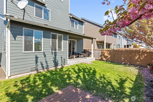 9957 Justman St SE, Yelm, WA 98597 - back of property featuring fence, a yard, and a patio area