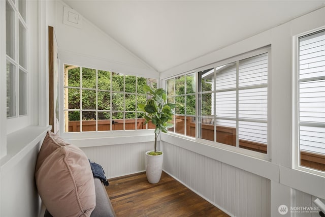 unfurnished sunroom with vaulted ceiling and wood finished floors