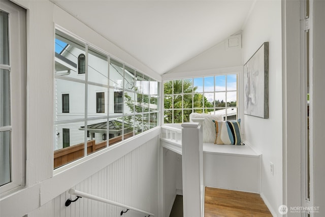 interior space with vaulted ceiling and wood finished floors