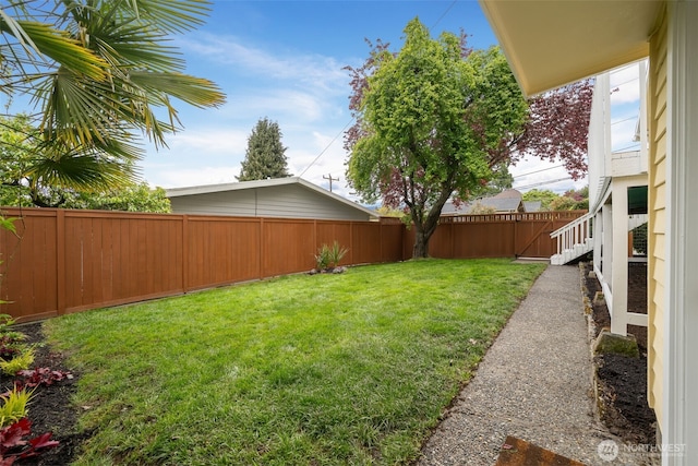 view of yard with a fenced backyard