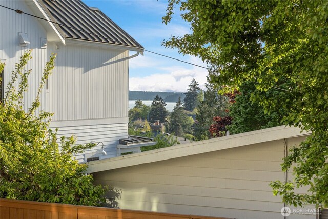 view of side of property featuring a standing seam roof and metal roof
