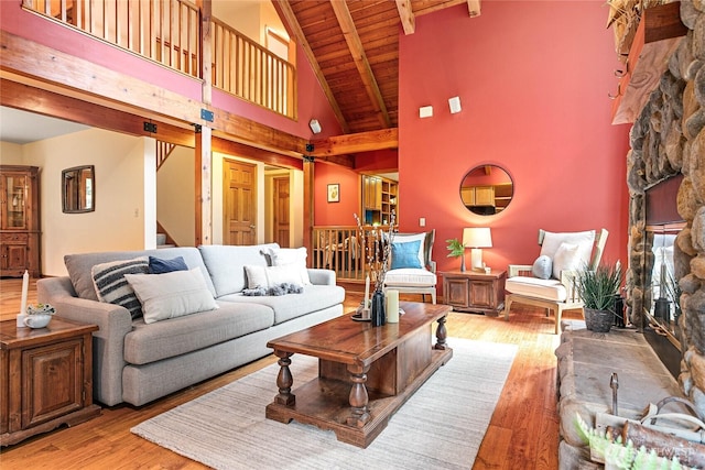 3337 Agate Heights Rd, Bellingham, WA 98226 - living area featuring a fireplace, hardwood / wood-style flooring, beamed ceiling, wood ceiling, and stairway