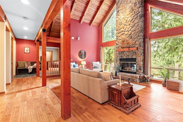 3337 Agate Heights Rd, Bellingham, WA 98226 - living room with a fireplace, a wealth of natural light, hardwood / wood-style flooring, and high vaulted ceiling
