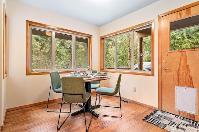 3337 Agate Heights Rd, Bellingham, WA 98226 - dining area featuring a healthy amount of sunlight, baseboards, light wood-style flooring, and visible vents