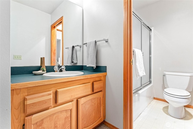 3337 Agate Heights Rd, Bellingham, WA 98226 - bathroom with vanity, toilet, baseboards, tile patterned floors, and enclosed tub / shower combo