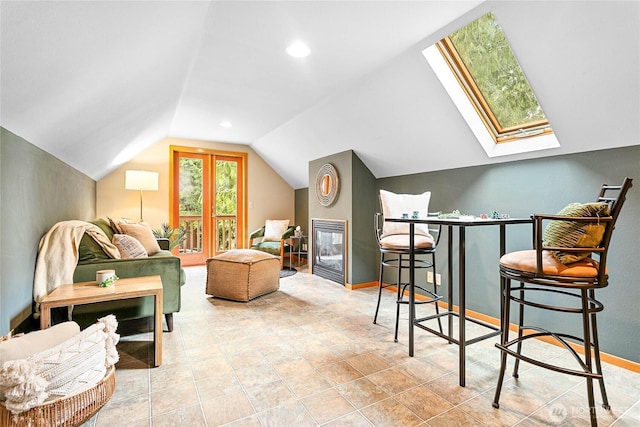 3337 Agate Heights Rd, Bellingham, WA 98226 - bonus room with a glass covered fireplace, baseboards, and lofted ceiling with skylight