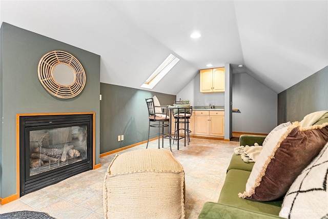 3337 Agate Heights Rd, Bellingham, WA 98226 - living area with baseboards, recessed lighting, a glass covered fireplace, and lofted ceiling with skylight