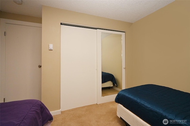 8100 Delridge Way SW Unit 1-3, Seattle, WA 98106 - bedroom with carpet floors, a textured ceiling, and a closet