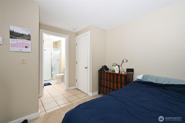 8100 Delridge Way SW Unit 1-3, Seattle, WA 98106 - bedroom with baseboards, a textured ceiling, ensuite bath, and light tile patterned floors