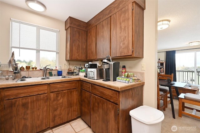 8100 Delridge Way SW Unit 1-3, Seattle, WA 98106 - kitchen featuring a sink, brown cabinets, and light countertops