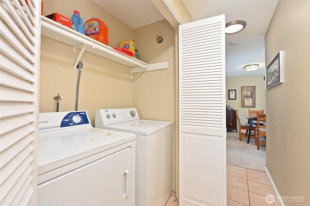 8100 Delridge Way SW Unit 1-3, Seattle, WA 98106 - washroom with washing machine and clothes dryer, light tile patterned flooring, laundry area, light colored carpet, and baseboards