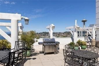 view of patio / terrace with outdoor dining space and a grill