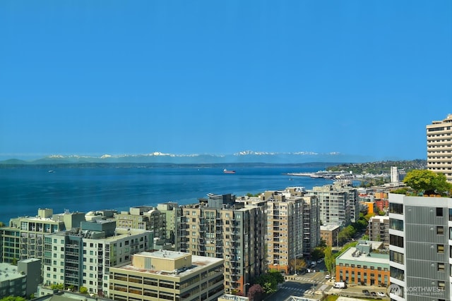 bird's eye view featuring a water view and a city view