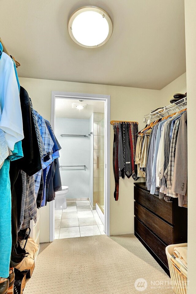 spacious closet with tile patterned flooring
