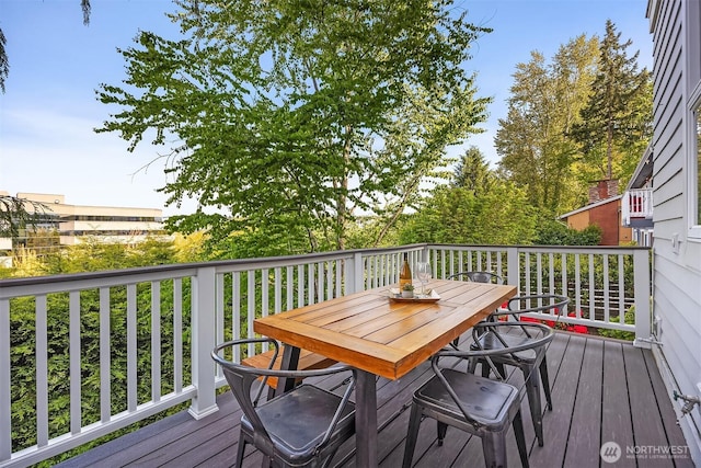 deck with outdoor dining space